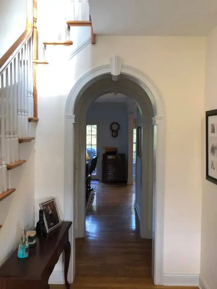 After: arched trim, doorway and window niche painted
