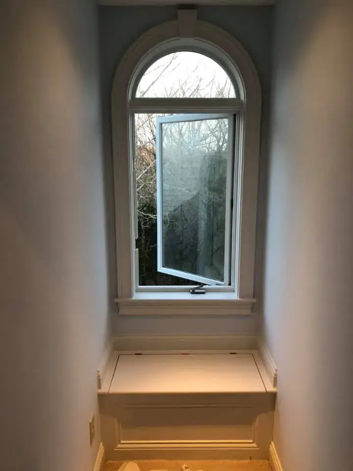 An arched window with an open pane above a built-in window seat. - My Personal Painter - My Personal Painter In progress: arched trim, doorway and window niche painted