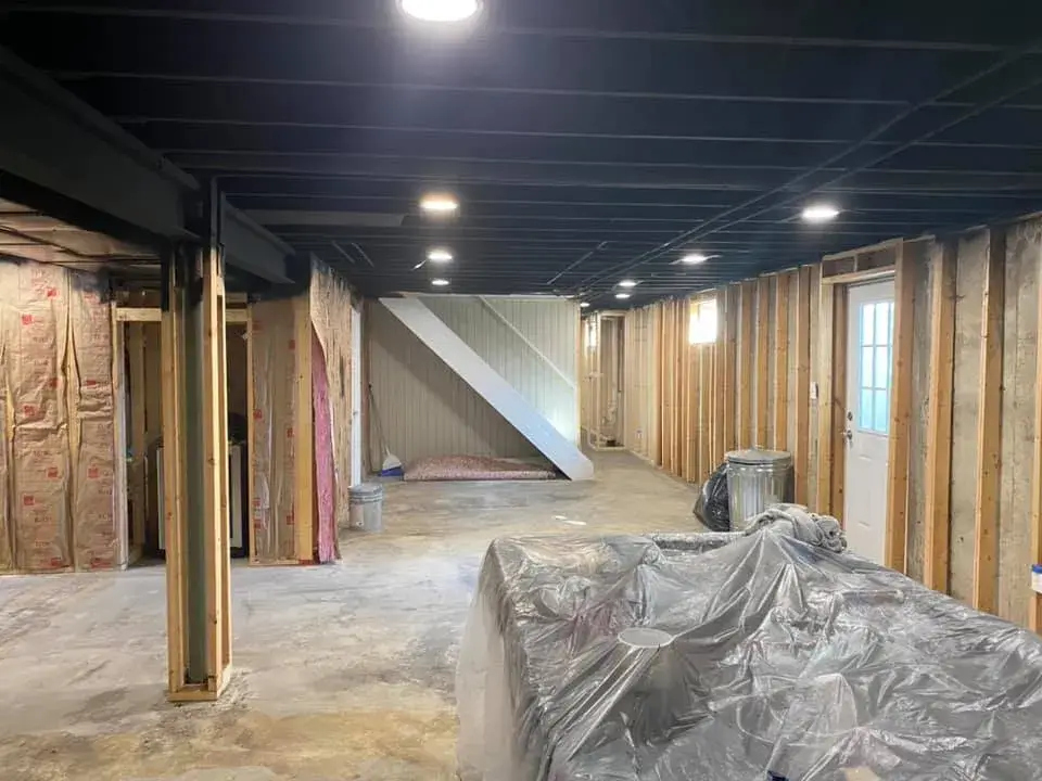 After: basement ceiling joists sprayed black