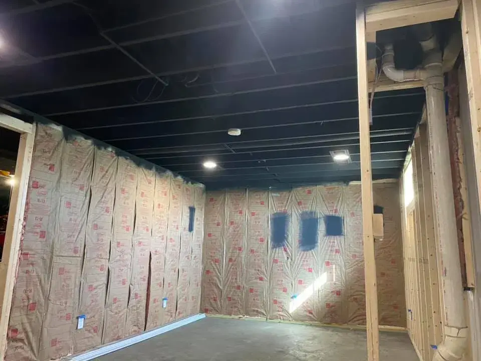 After: basement ceiling joists sprayed black