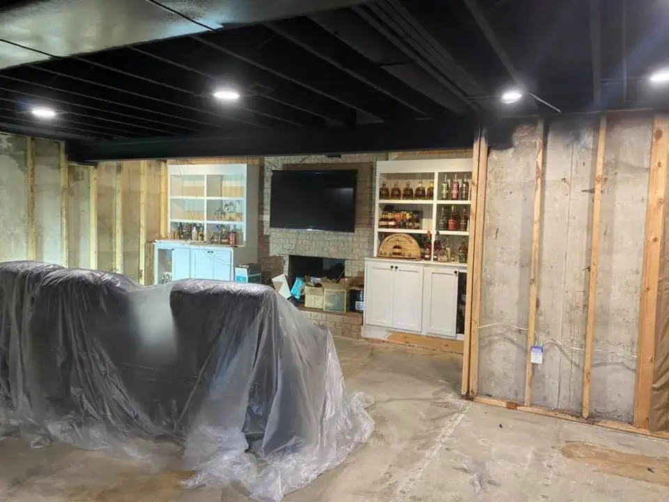 After: basement ceiling joists sprayed black