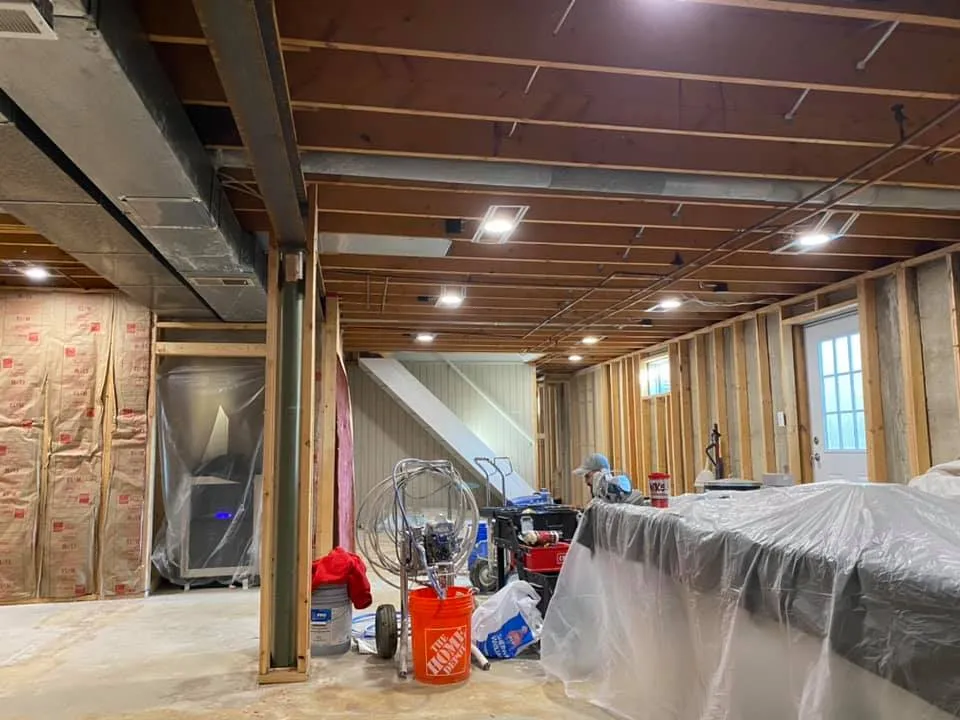 In progress: basement ceiling joists sprayed black