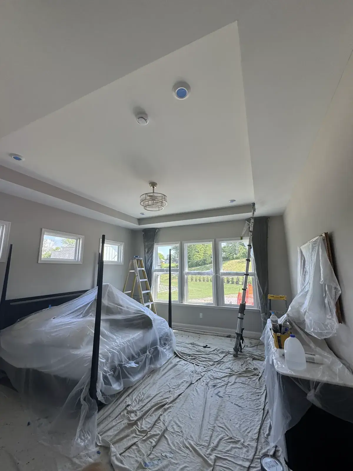 Before: bedroom tray ceiling, den painted deep green, brick fireplace whitewashed