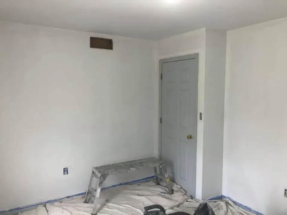 After: bedroom walls repaired and painted