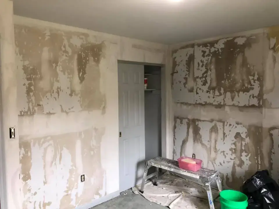 Before: bedroom walls repaired and painted