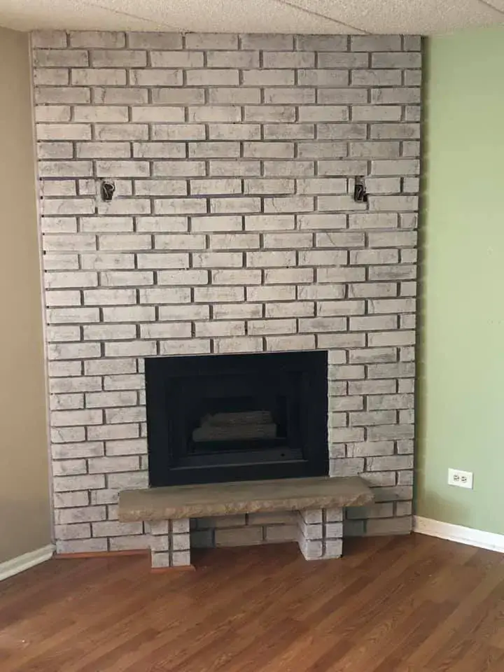 After: brick fireplace painted light gray
