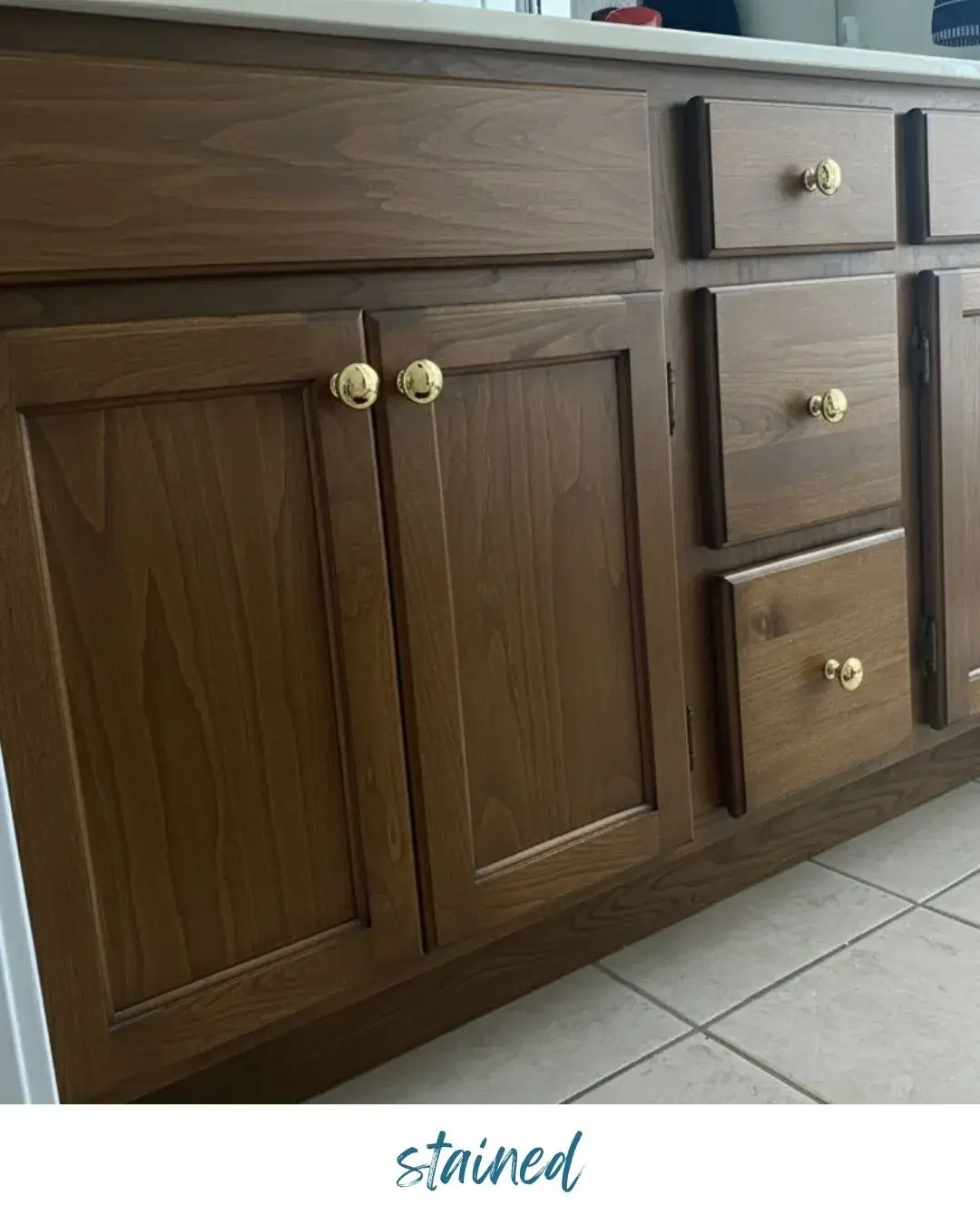 Before: cabinet base: stained vs painted dark