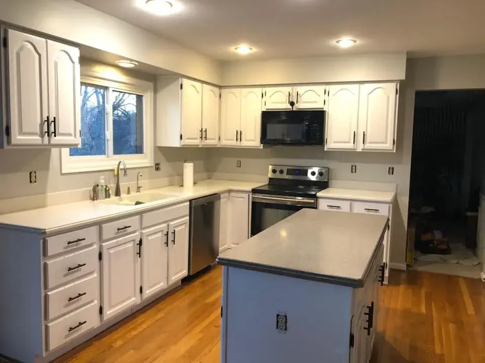After: cherry kitchen painted white uppers, gray-blue island and lowers