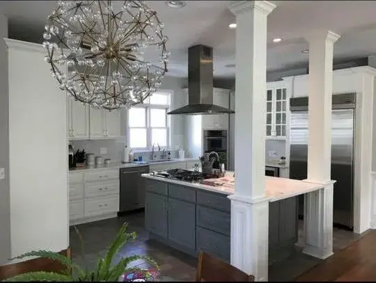 After: cherry kitchen with column painted white, gray island