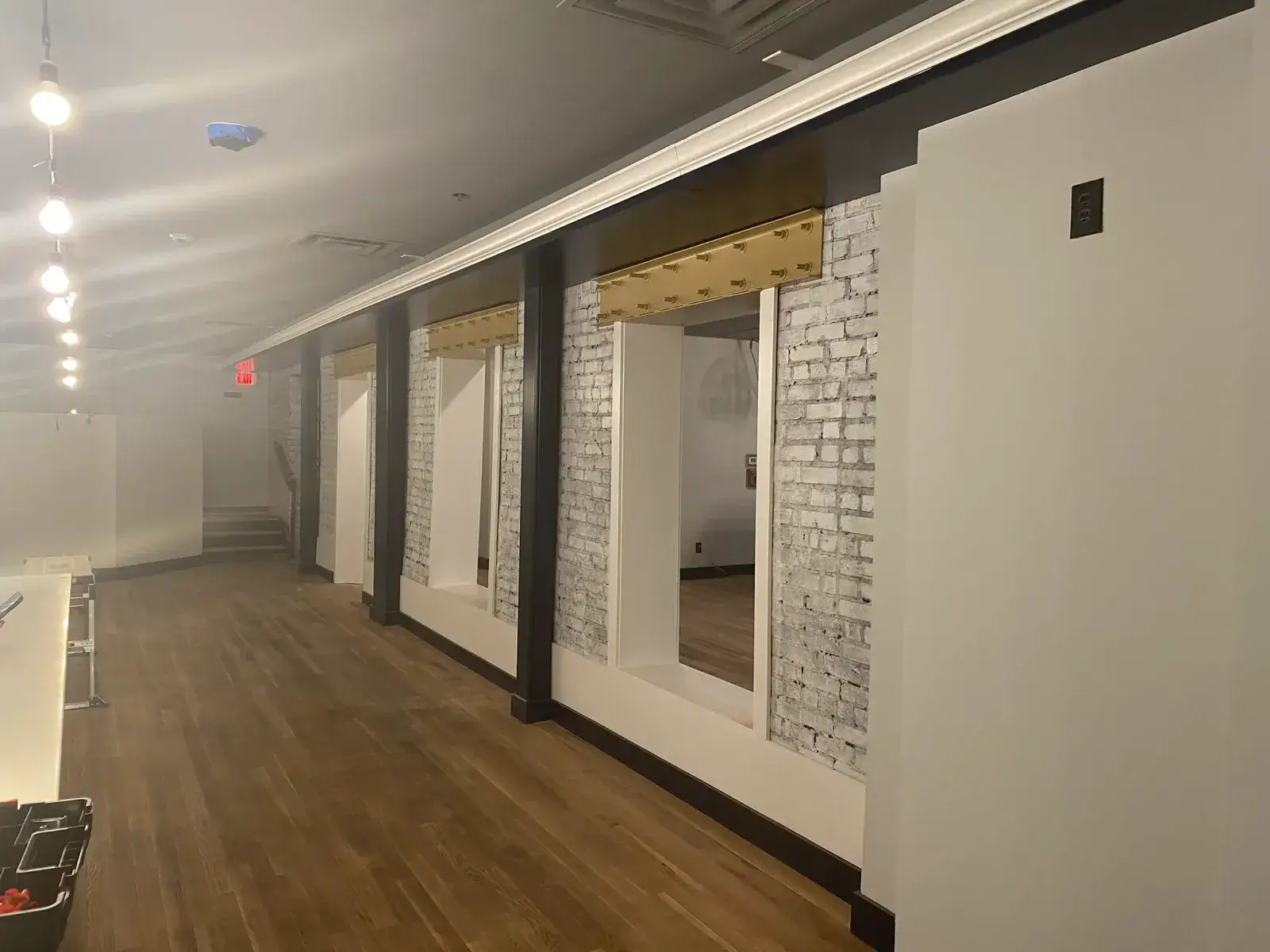 After: commercial space: exposed brick to whitewash