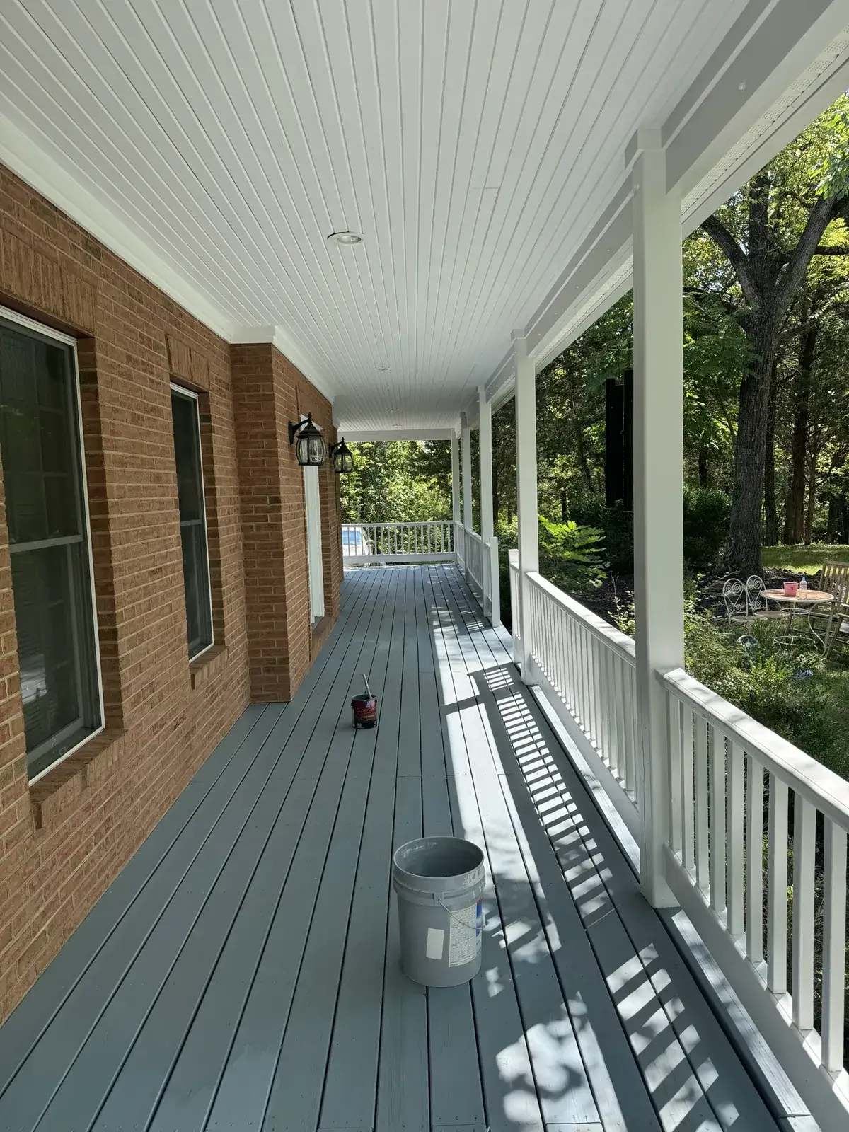 After: covered porch floor painted (August 2024)