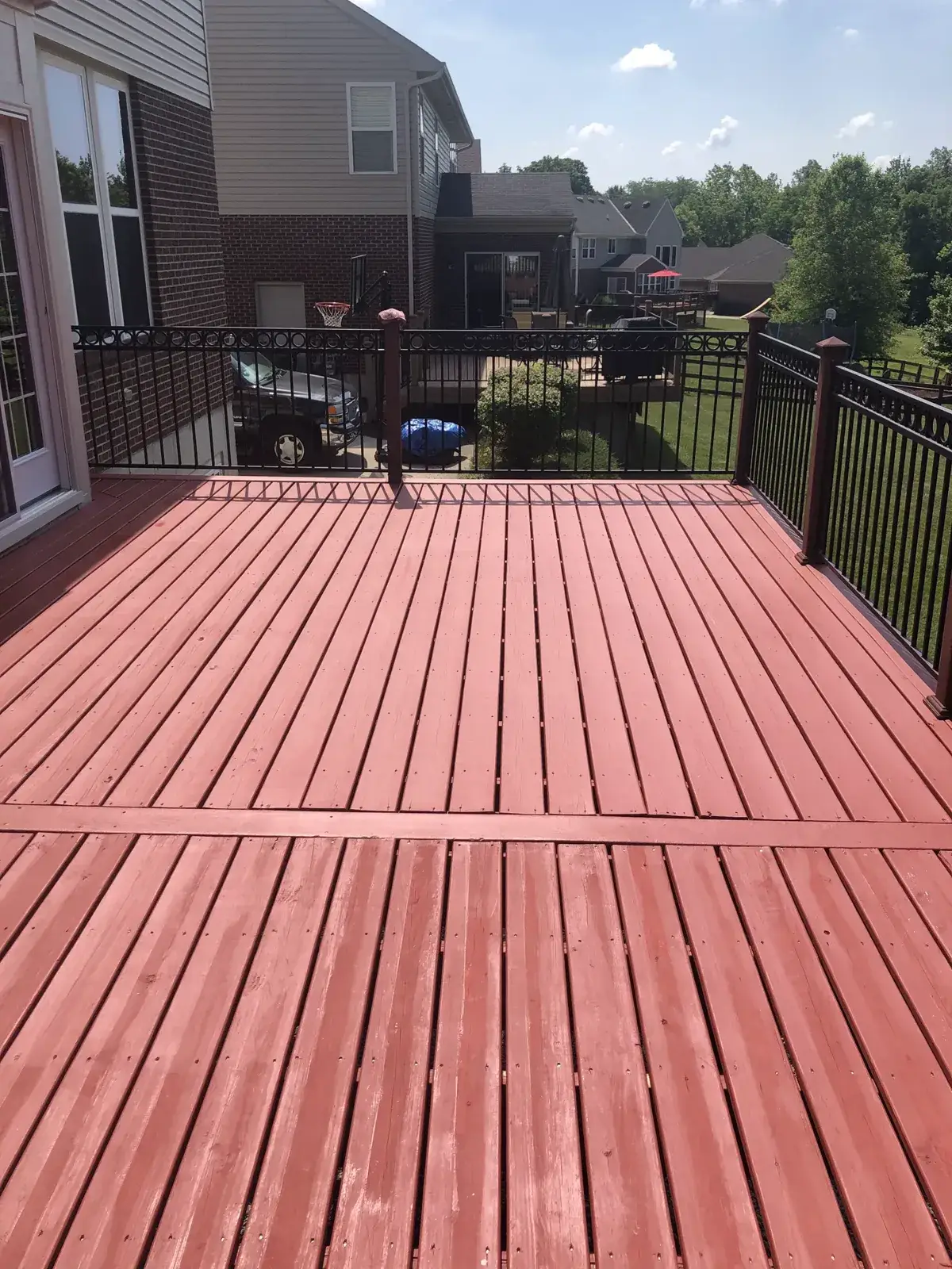 After: deck B: washed, then red solid stain