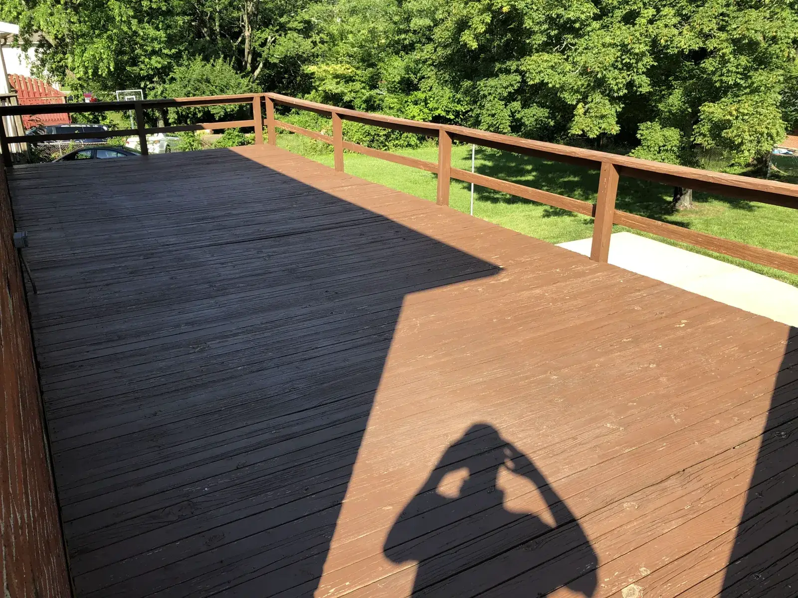 After: deck D: brown railing deck restained darker