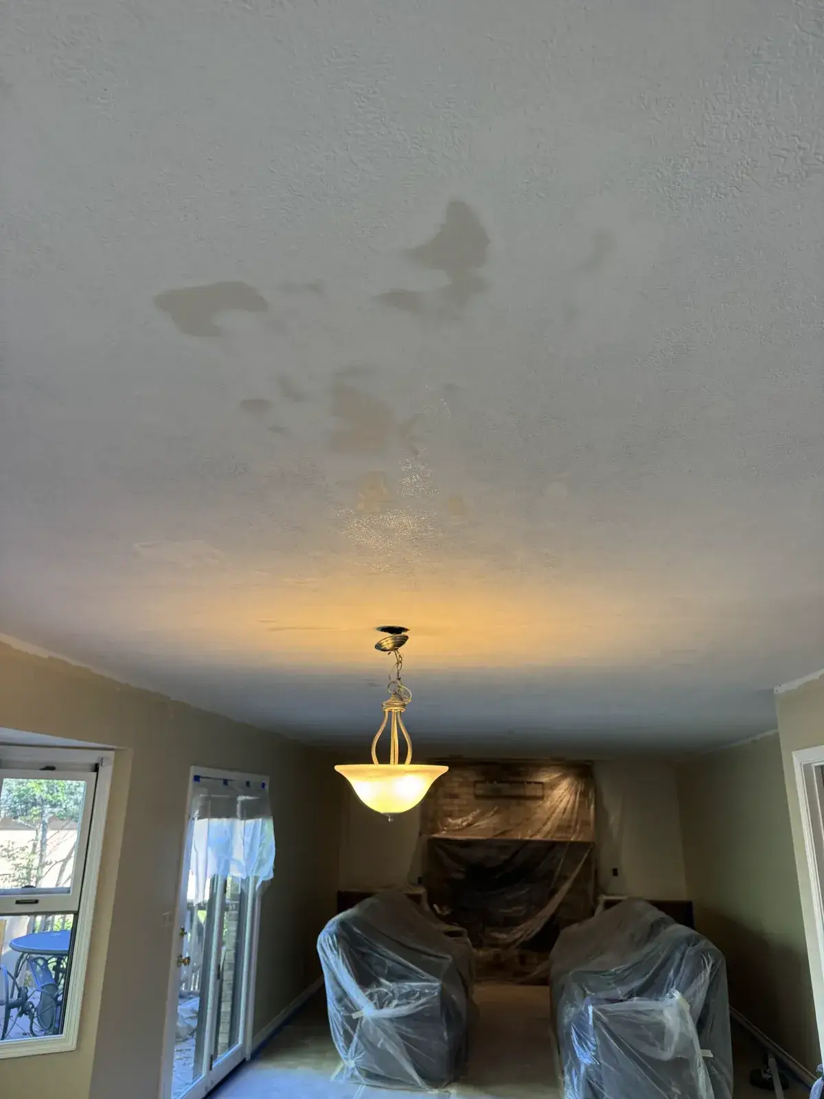 After: dining room water-stained ceiling repaired