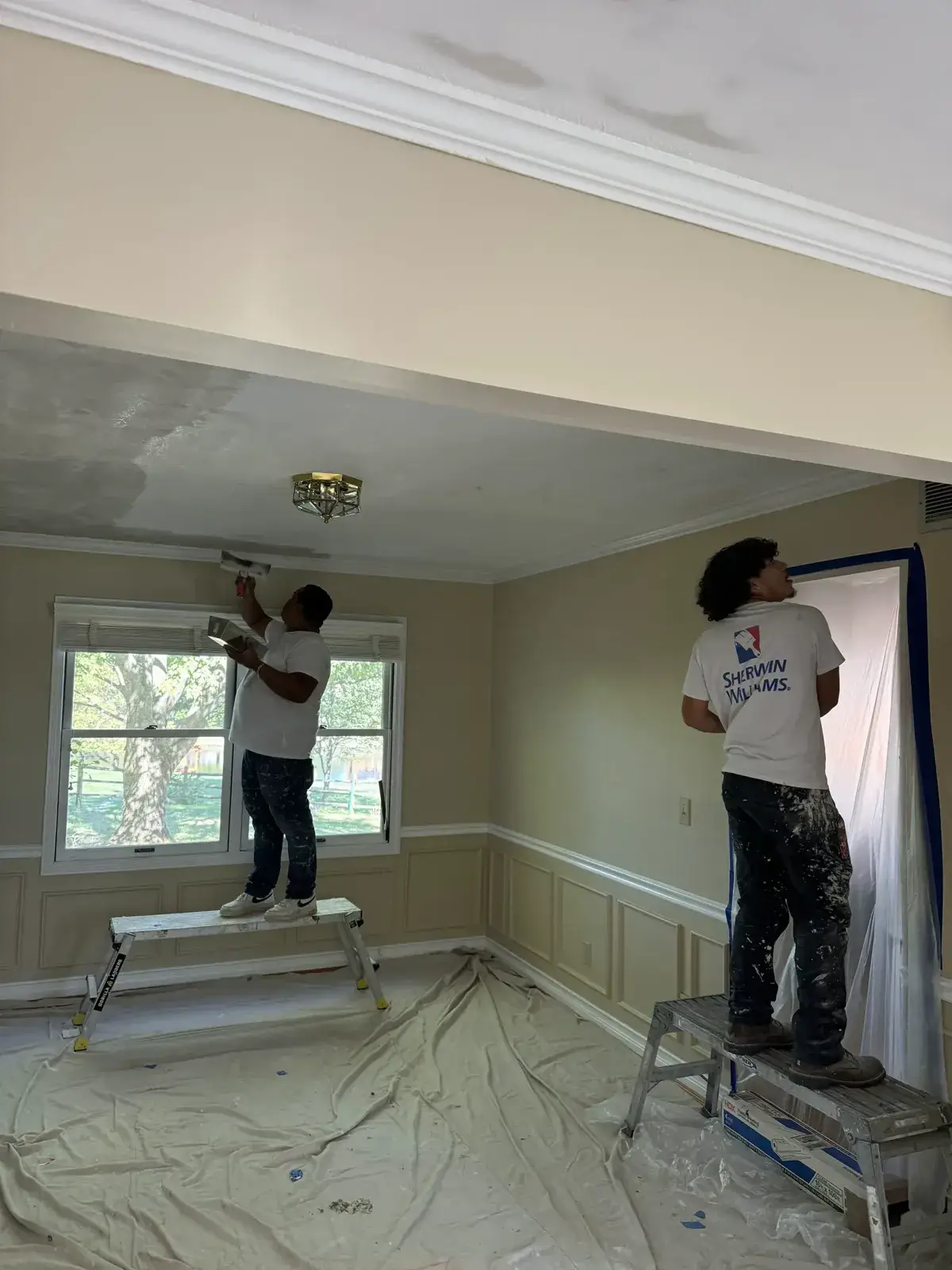 Before: dining room water-stained ceiling repaired