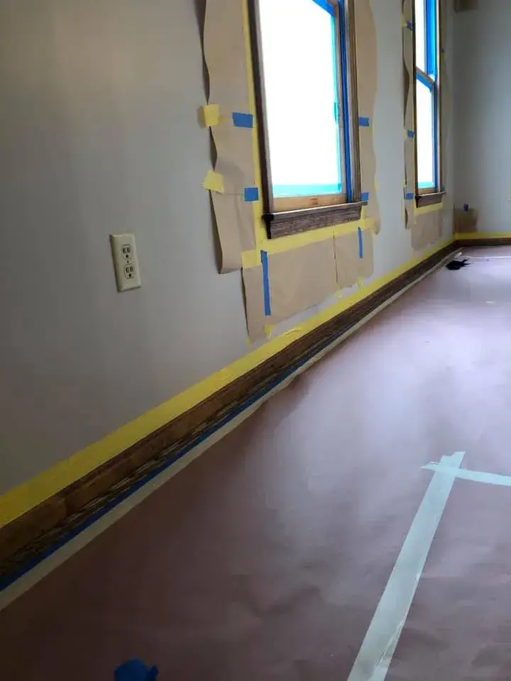 In progress: foyer, pool table room and dining room: wood trim painted white