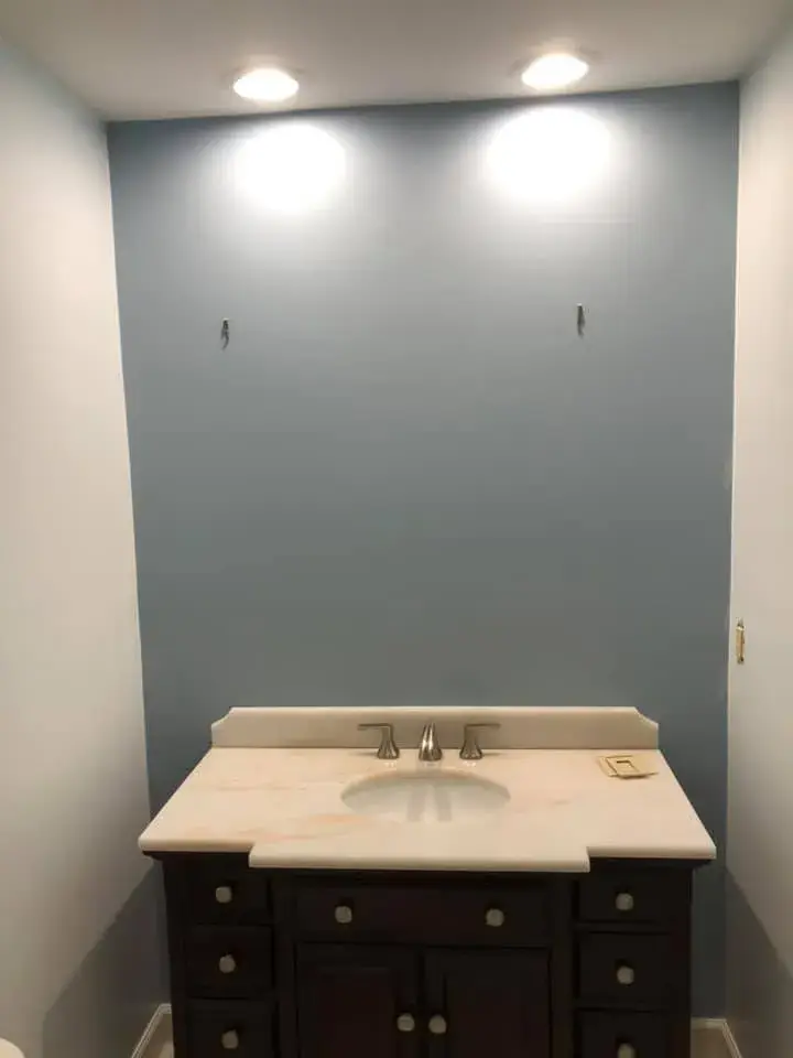 After: half bath repainted from yellow to blue-gray