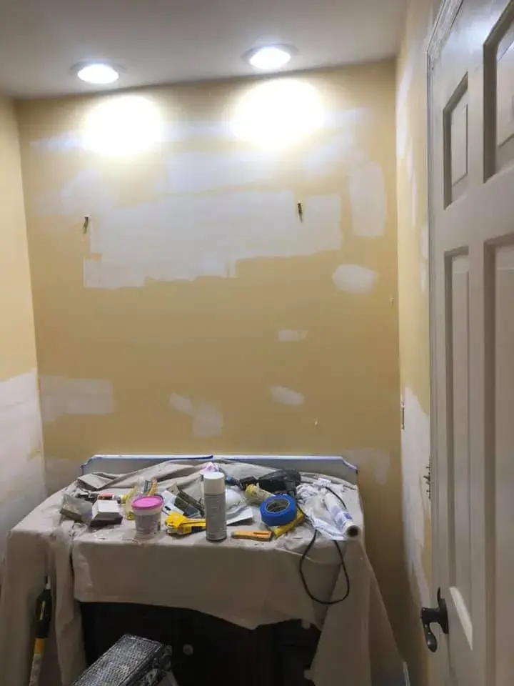Before: half bath repainted from yellow to blue-gray