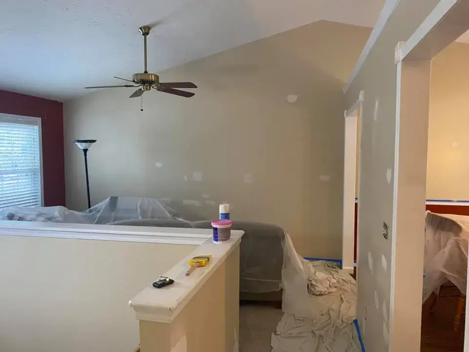 In progress: interior repaint: red and orange lower walls to gray, chair rail