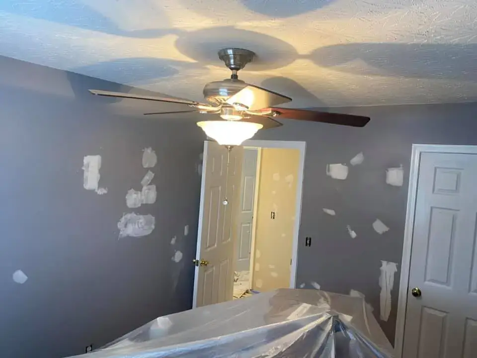 In progress: interior repaint: red and orange lower walls to gray, chair rail