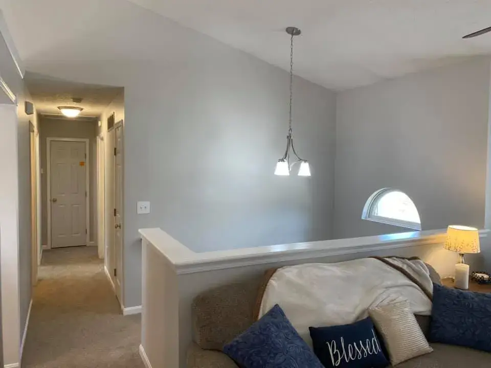 In progress: interior repaint: red and orange lower walls to gray, chair rail
