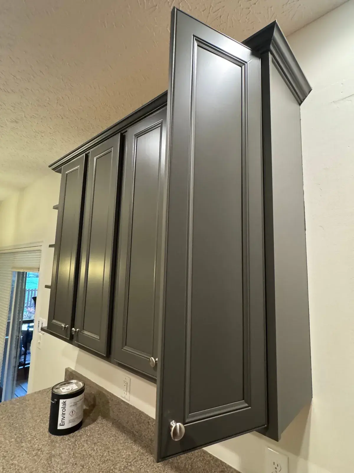 After: kitchen, bar desk and hutch painted dark gray