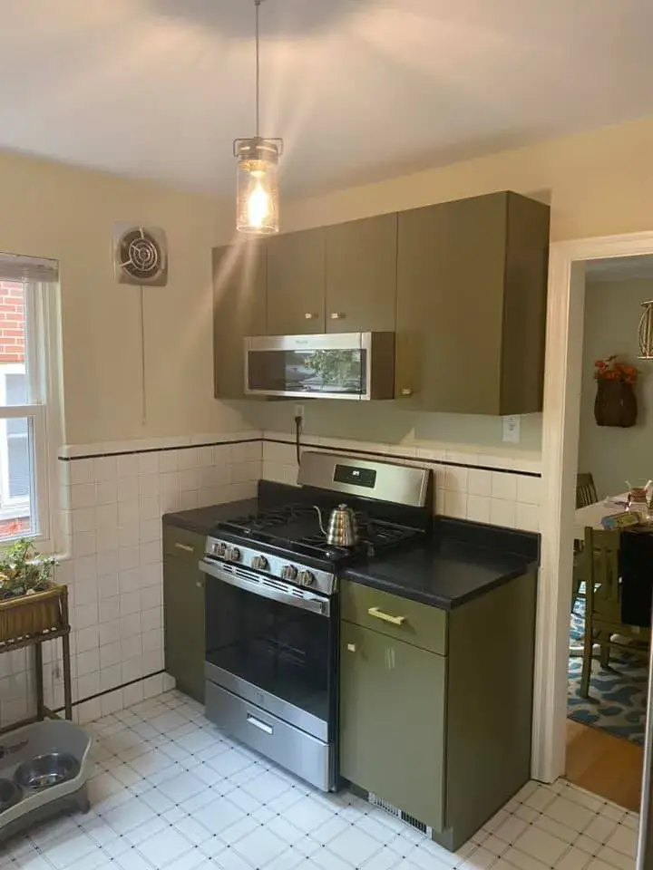 A kitchen with olive green cabinets, a stainless steel gas range, and white tiled walls. - My Personal Painter - My Personal Painter After: kitchen cabinets: white to olive green
