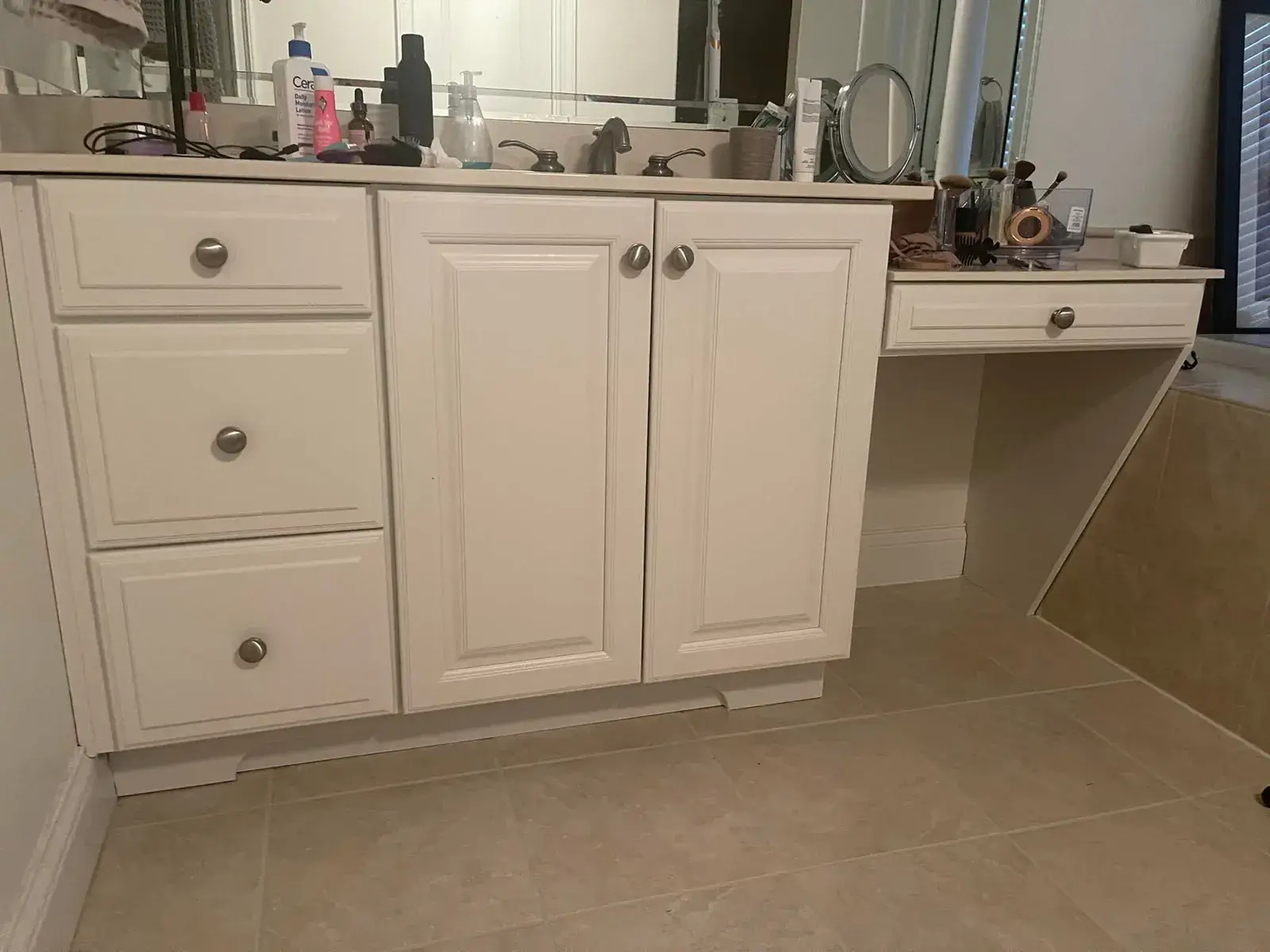 White bathroom vanity with drawers, double cabinet doors, and an attached makeup vanity area. - My Personal Painter - My Personal Painter After: kitchen cherry cabinets to white with a green island, two-story great room, dining room and foyer