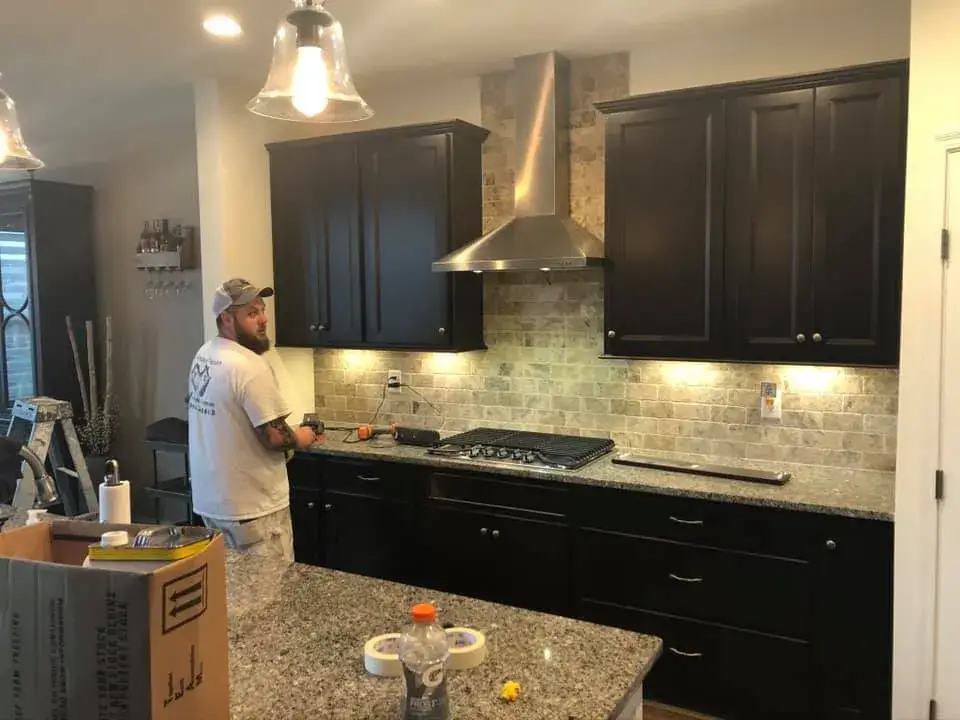 Before: kitchen dark cabinets painted white