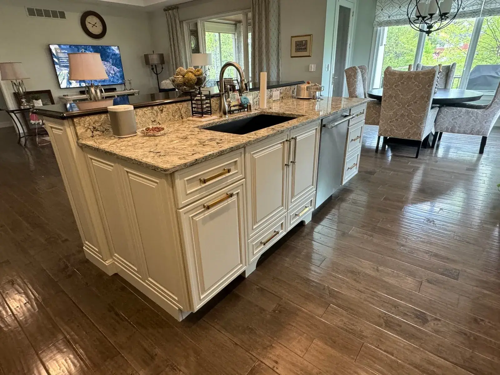 After: kitchen glazed sage cabinets painted white, dark lowers and pendant lights