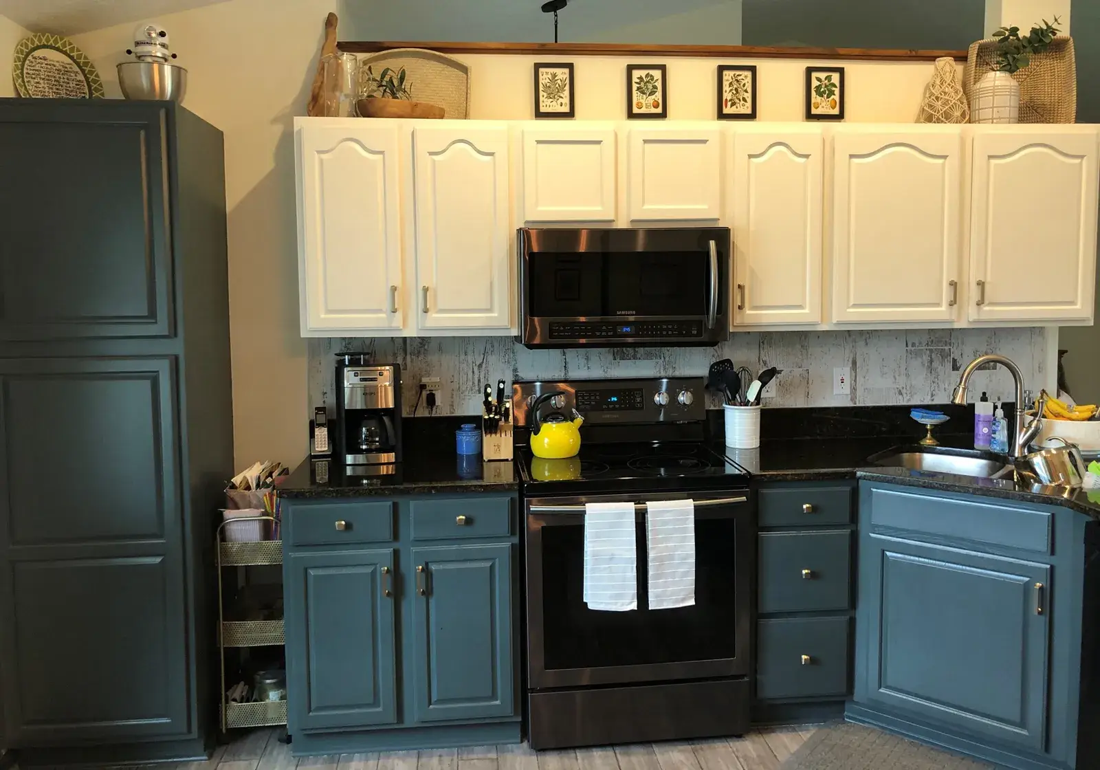 After: kitchen oak cabinets painted white uppers with dark green lowers