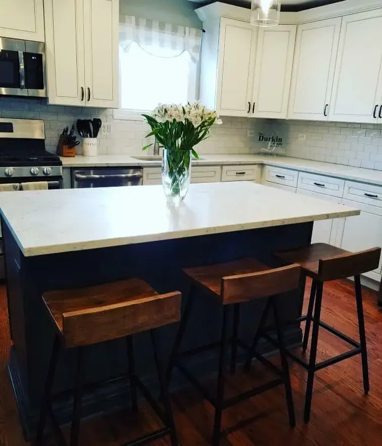 After: kitchen white uppers, dark lowers and a blue island