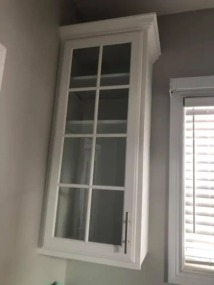 After: kitchen with arched window: cabinets refinished, white uppers and blue-gray lowers