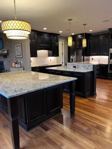 After: kitchen with two islands: white cabinets painted dark