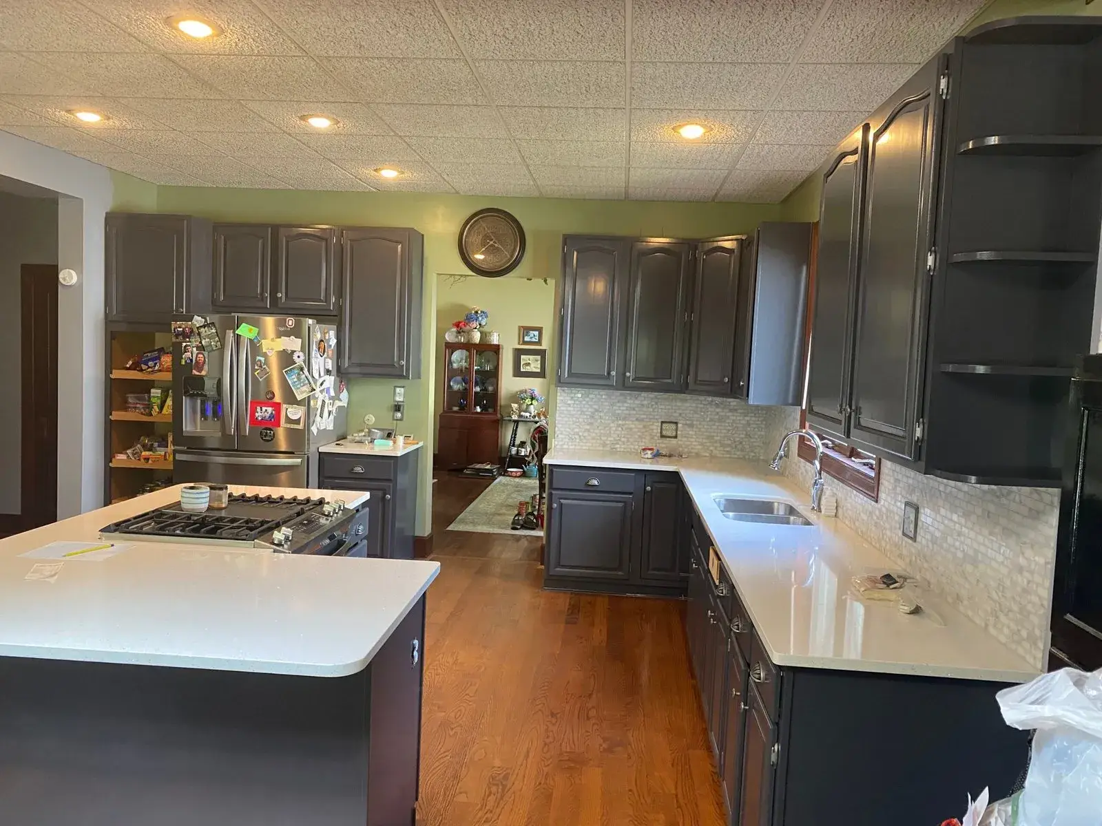 After: kitchen wood cabinets painted dark