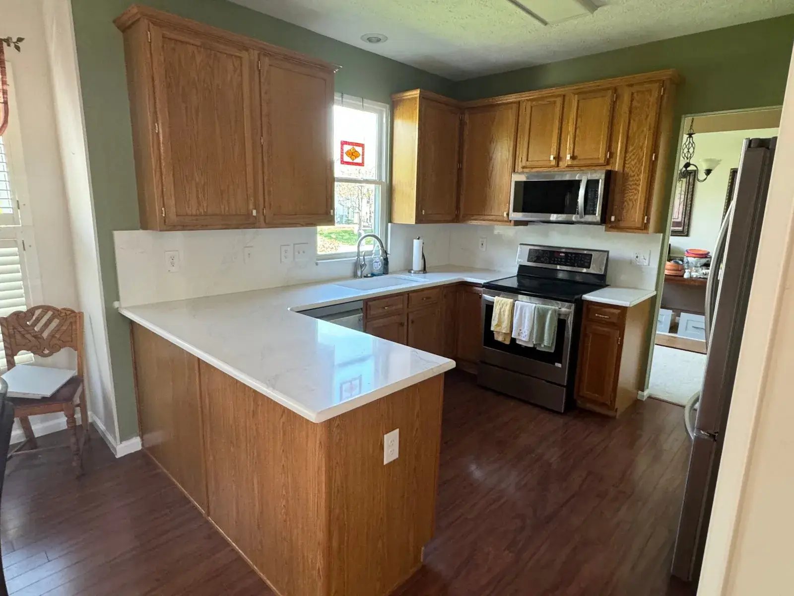 Before: kitchen wood cabinets painted gray