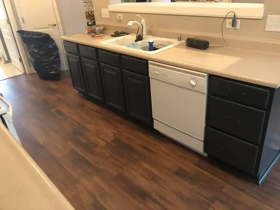 After: kitchen wood cabinets painted white uppers, dark lowers
