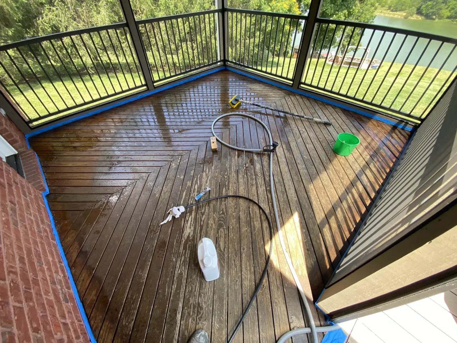 Before: lake home: herringbone screened porch deck stained