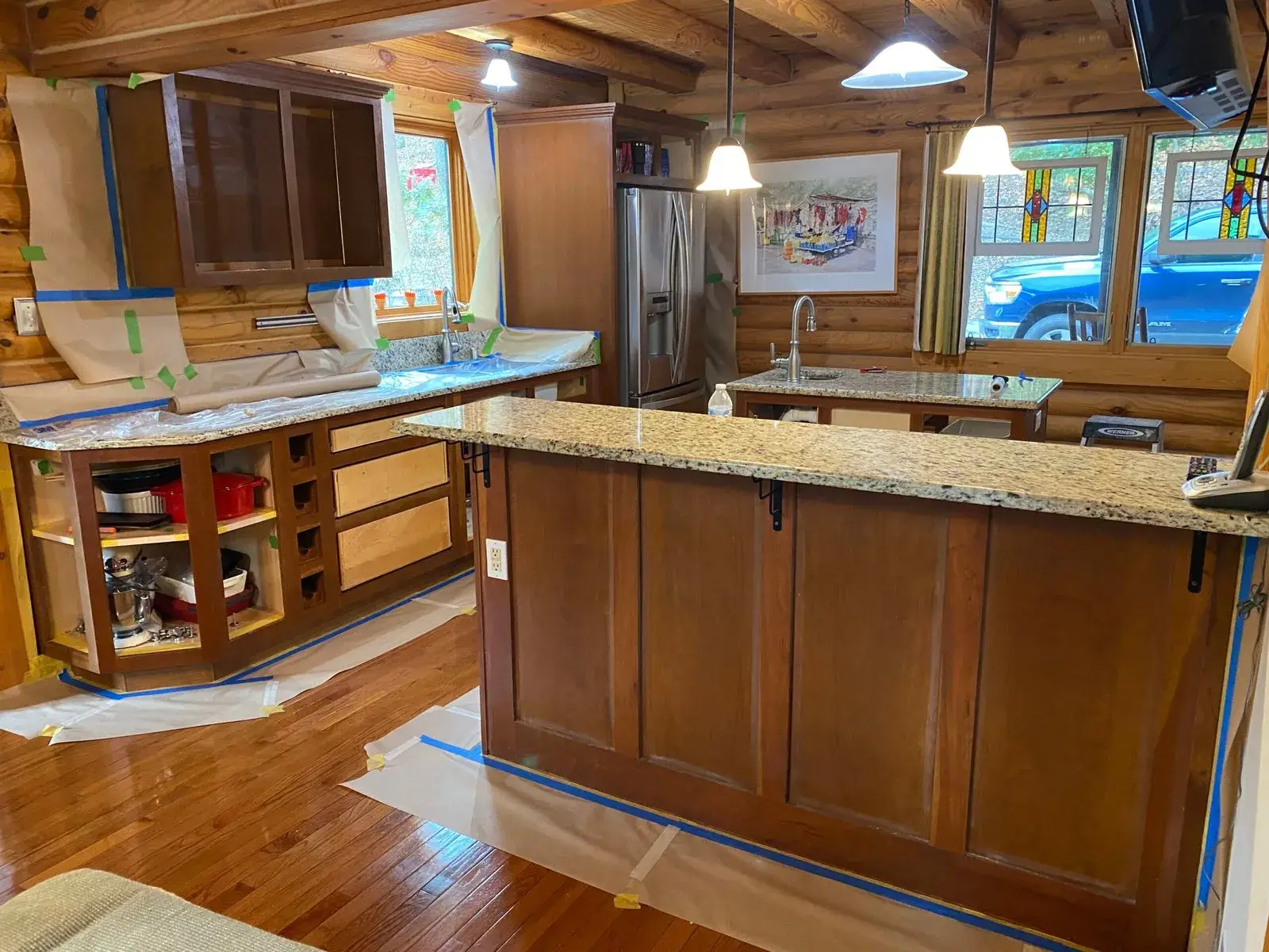 Before: log cabin kitchen painted green
