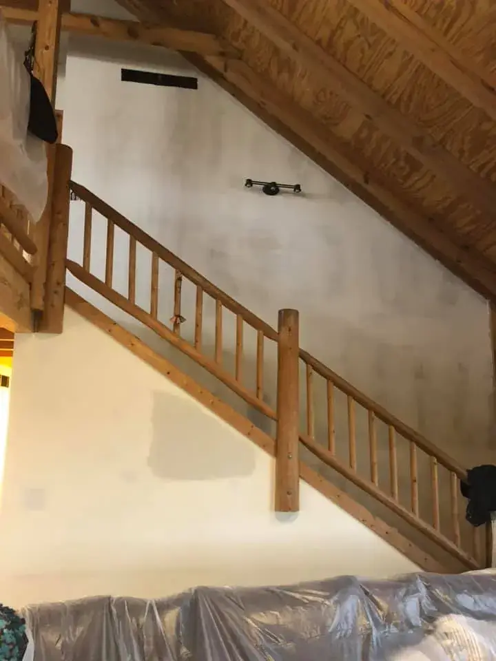 After: log home with timber ceilings: walls painted