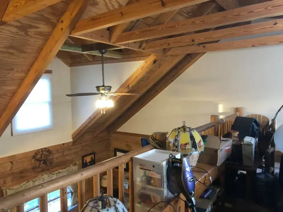 Before: log home with timber ceilings: walls painted