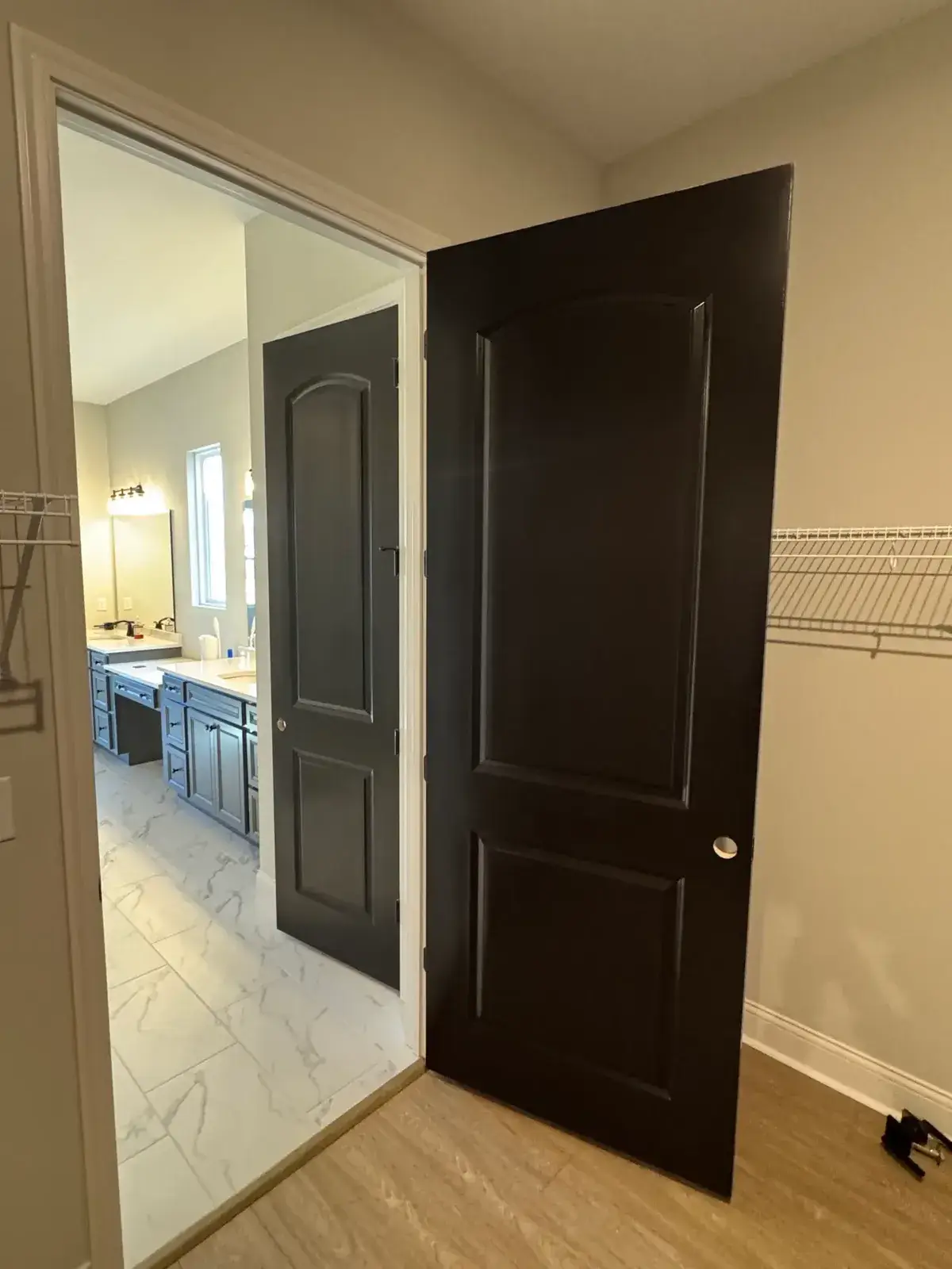 After: new-build house: black archway, accent walls and doors