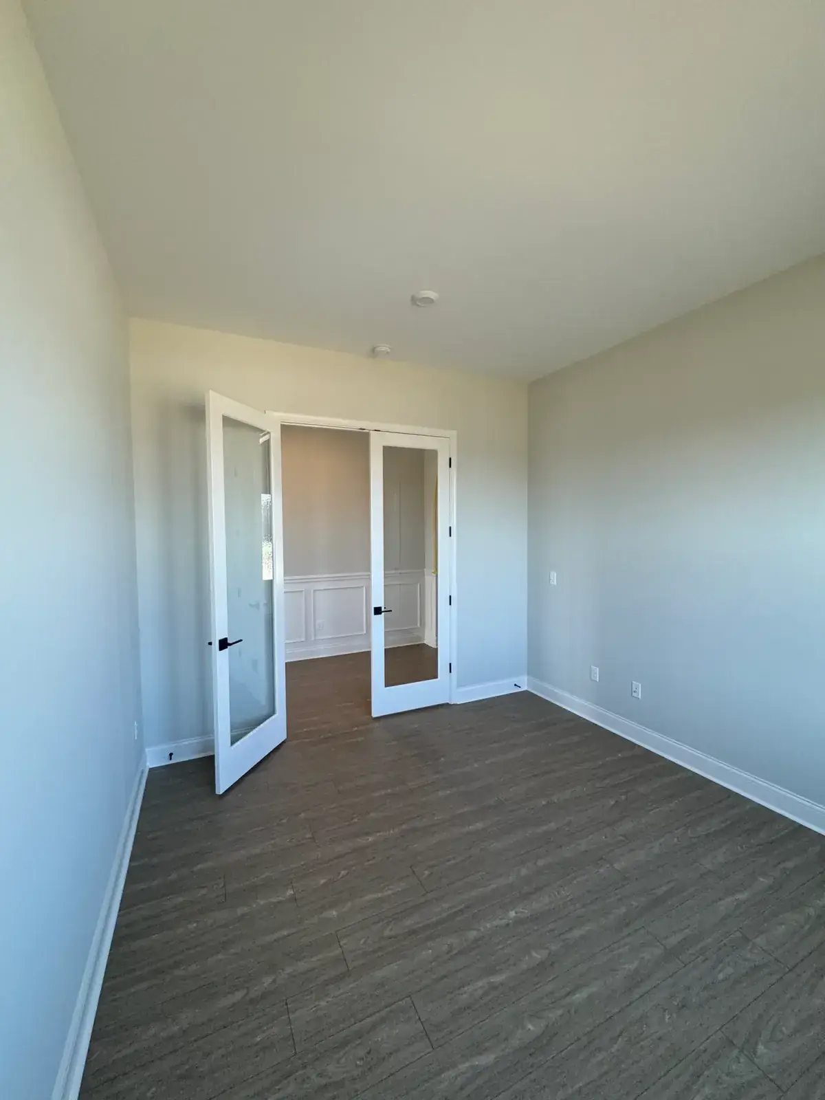 After: new-build house: black archway, accent walls and doors