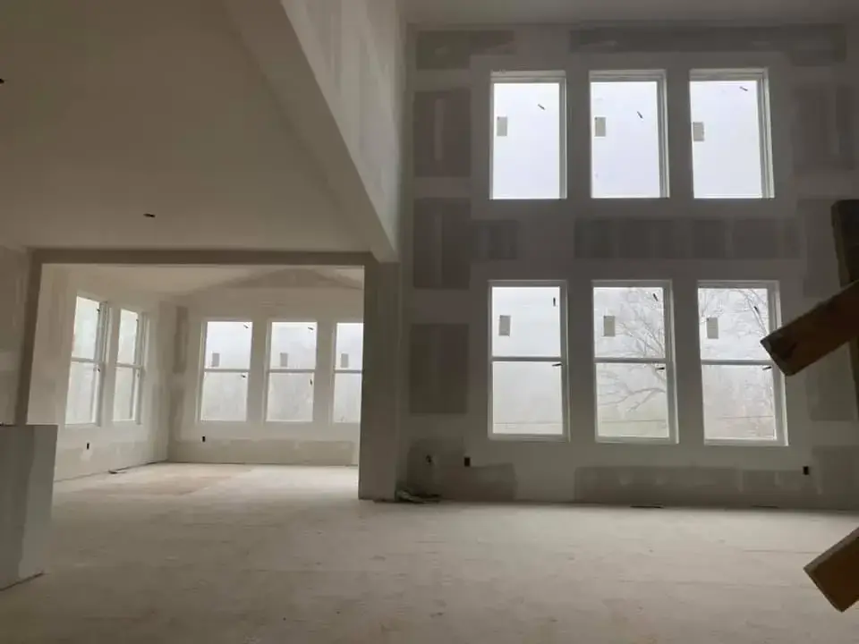 Before: new-construction interior with open stairwell
