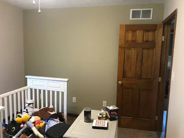 After: nursery repainted from light blue to beige