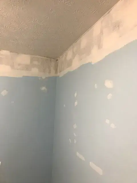 Before: nursery repainted from light blue to beige