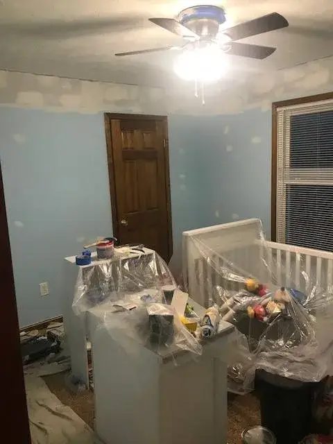 Before: nursery repainted from light blue to beige