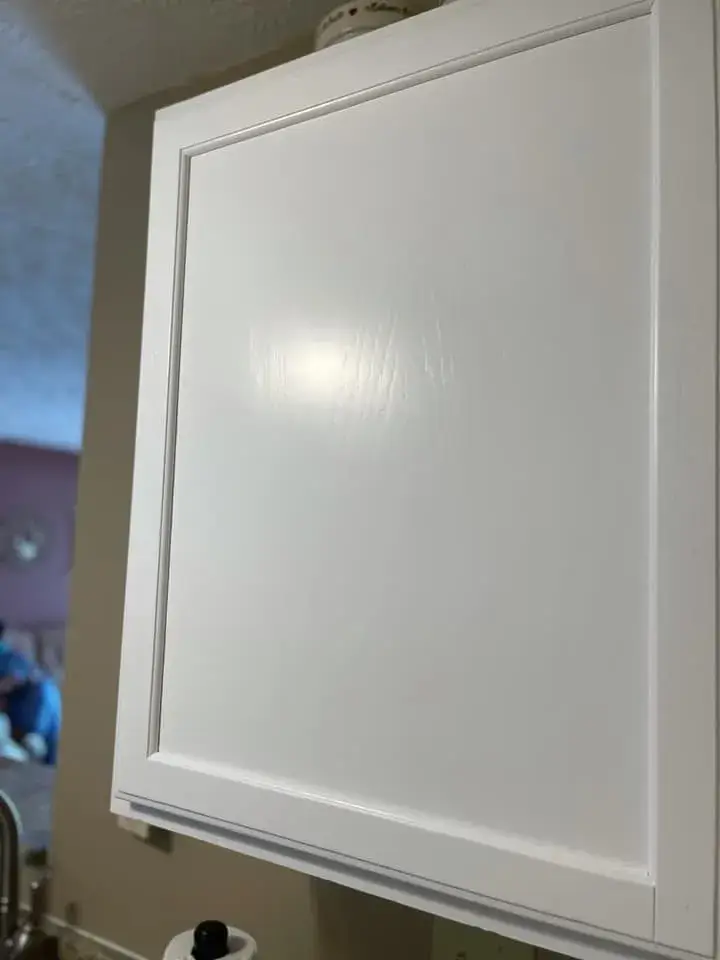 A white Shaker-style kitchen cabinet door. - My Personal Painter - My Personal Painter After: oak kitchen cabinets painted white