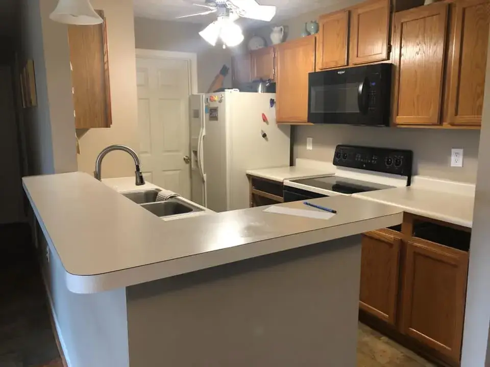 Before: oak kitchen cabinets painted white