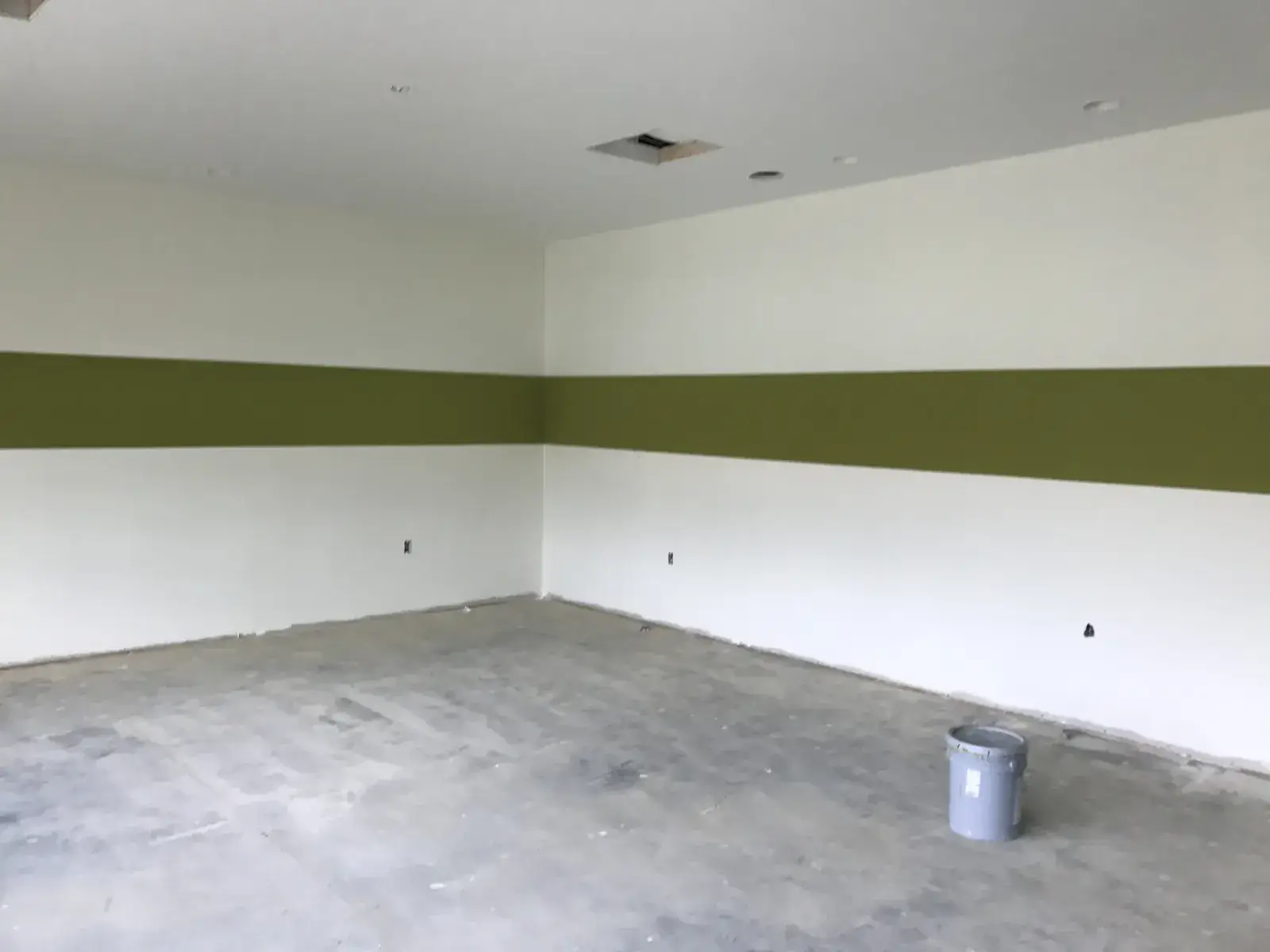 After: olive and charcoal striped commercial walls